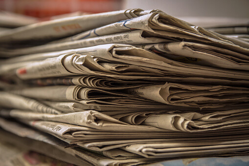 Stacked old news paper